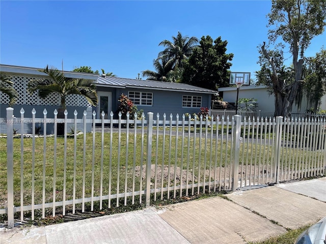 ranch-style home with a front lawn