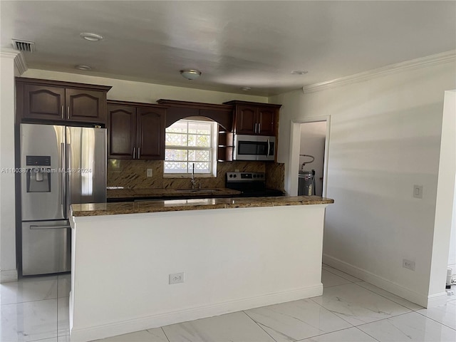 kitchen with crown molding, sink, appliances with stainless steel finishes, tasteful backsplash, and dark brown cabinets