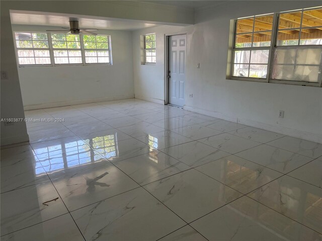 unfurnished room with ceiling fan