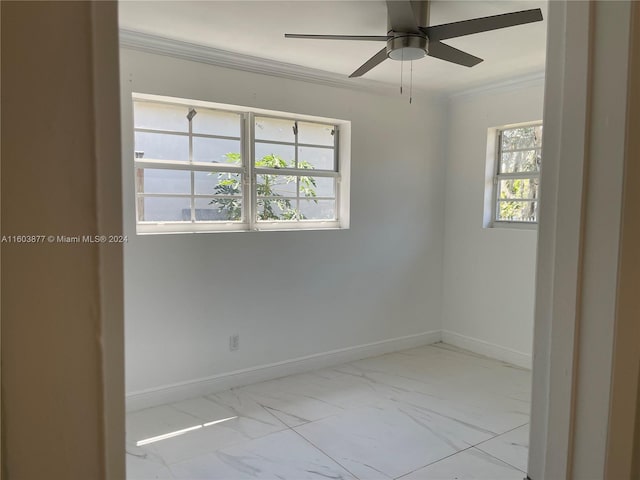 unfurnished room with ceiling fan and crown molding