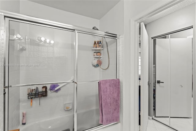 bathroom with separate shower and tub and tile patterned floors