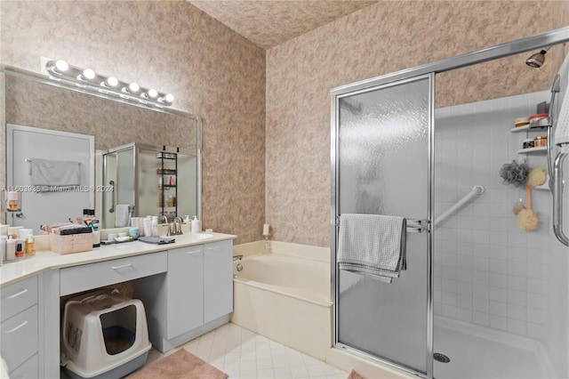 bathroom featuring vanity, tile patterned flooring, and shower with separate bathtub