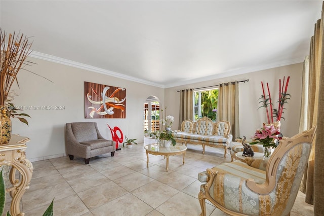 living room with ornamental molding and light tile patterned floors