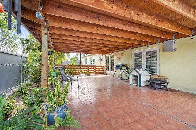 view of patio with an outdoor fire pit