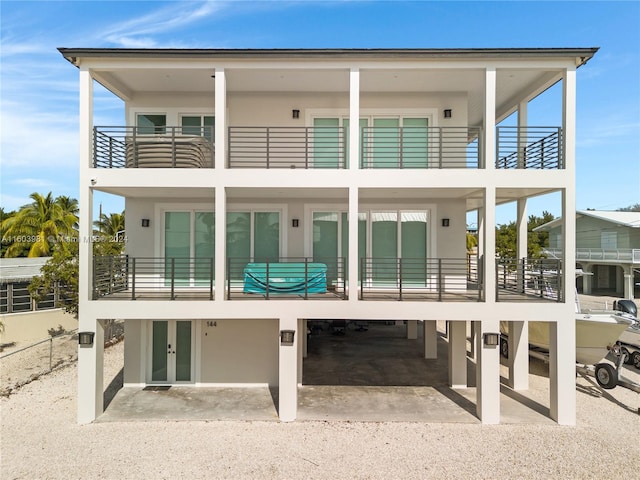 rear view of property featuring a balcony