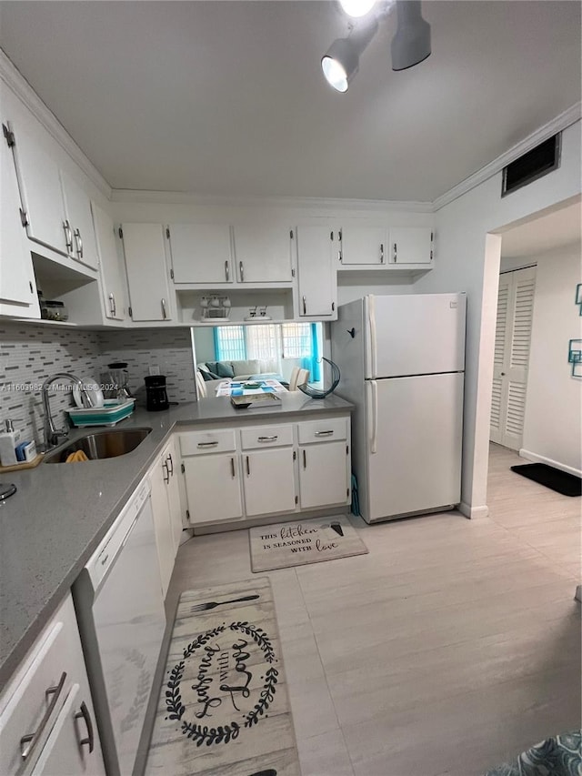 kitchen featuring white cabinets, white appliances, crown molding, tasteful backsplash, and sink