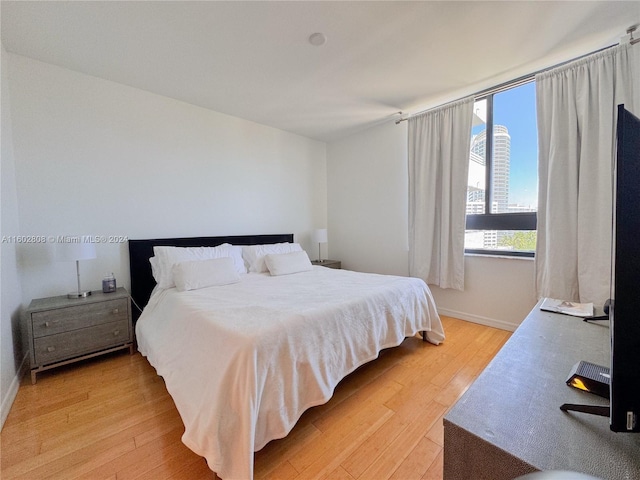 bedroom with light hardwood / wood-style flooring