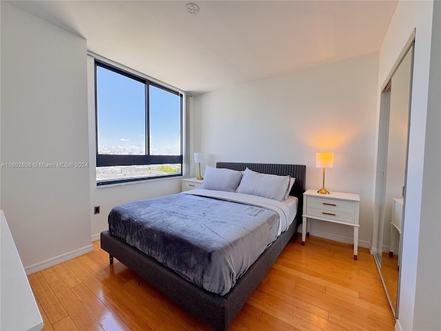 bedroom with light wood-type flooring