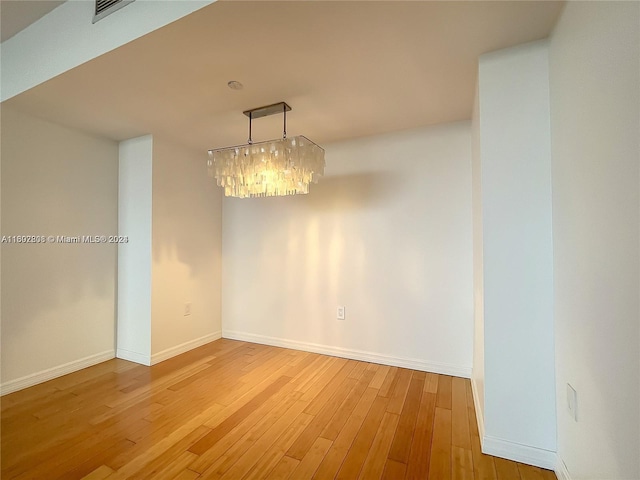 unfurnished dining area featuring hardwood / wood-style floors