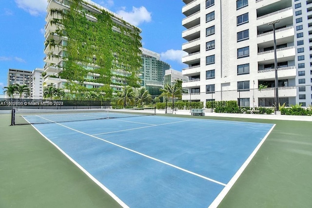 view of sport court with basketball hoop