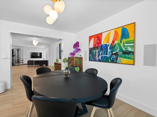 dining room with light wood-type flooring