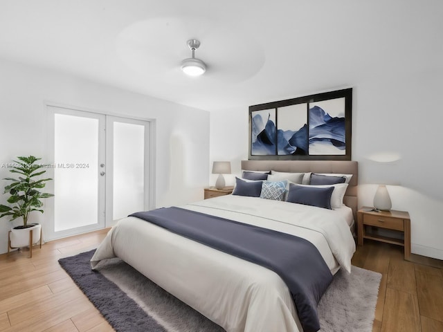 bedroom with ceiling fan and hardwood / wood-style flooring