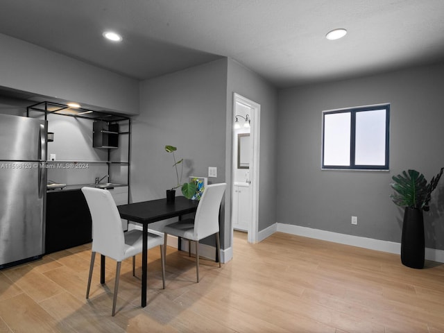 dining room with light hardwood / wood-style floors