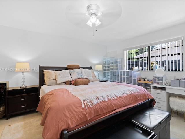 tiled bedroom with ceiling fan