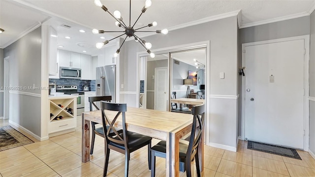 tiled dining space featuring an inviting chandelier, crown molding, and a textured ceiling