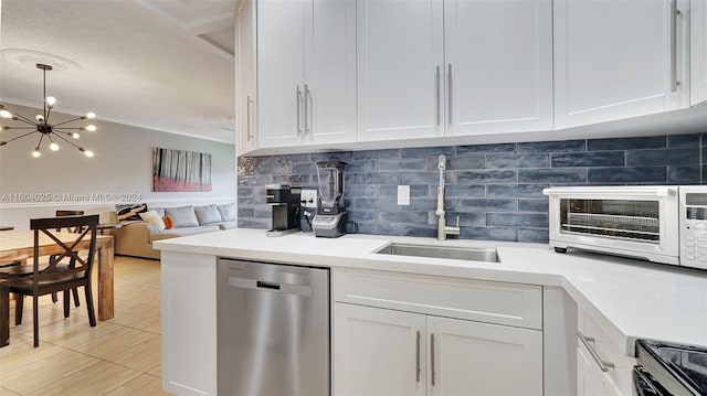 kitchen with an inviting chandelier, white cabinets, dishwasher, and sink