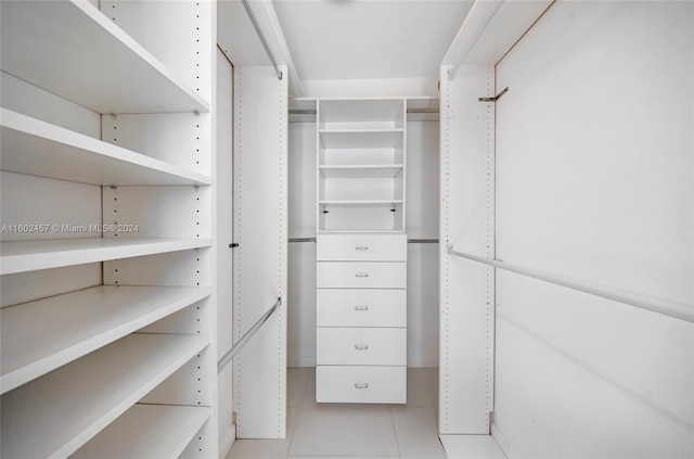 spacious closet with light tile patterned flooring