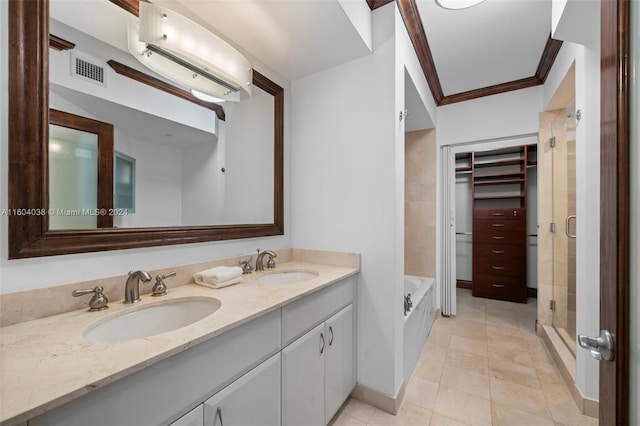 bathroom featuring tile floors, dual bowl vanity, ornamental molding, and separate shower and tub