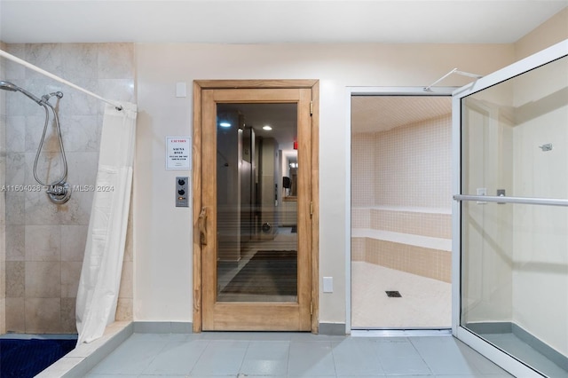 bathroom featuring tile floors and a shower with shower curtain