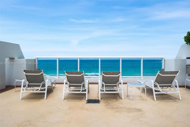 view of swimming pool with a water view