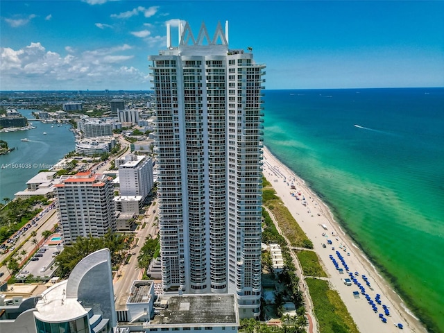 birds eye view of property featuring a view of the beach and a water view