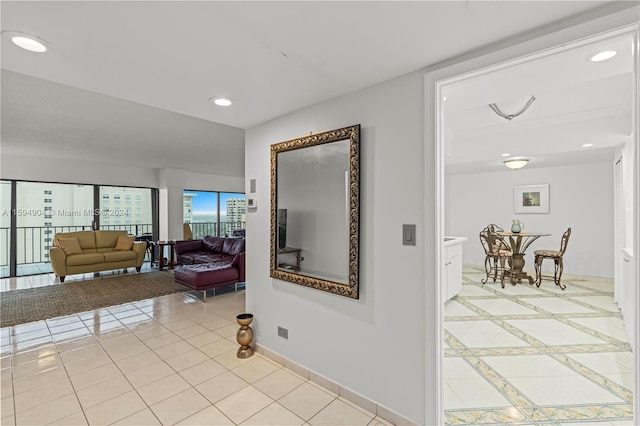 hallway featuring light tile floors