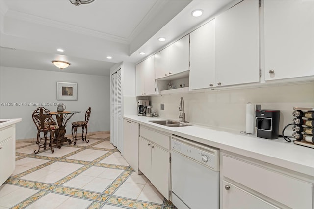 kitchen with dishwasher, sink, white cabinetry, and crown molding