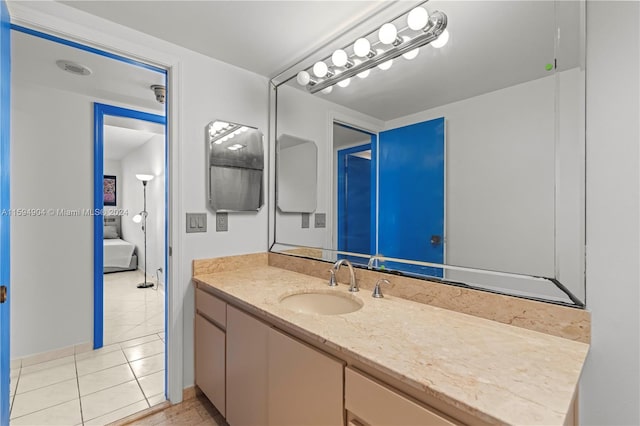 bathroom featuring tile floors and oversized vanity