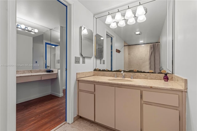 bathroom with hardwood / wood-style flooring and vanity