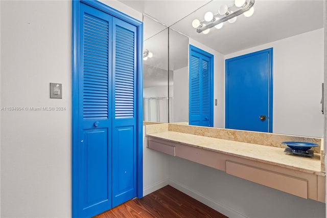 bathroom with hardwood / wood-style flooring