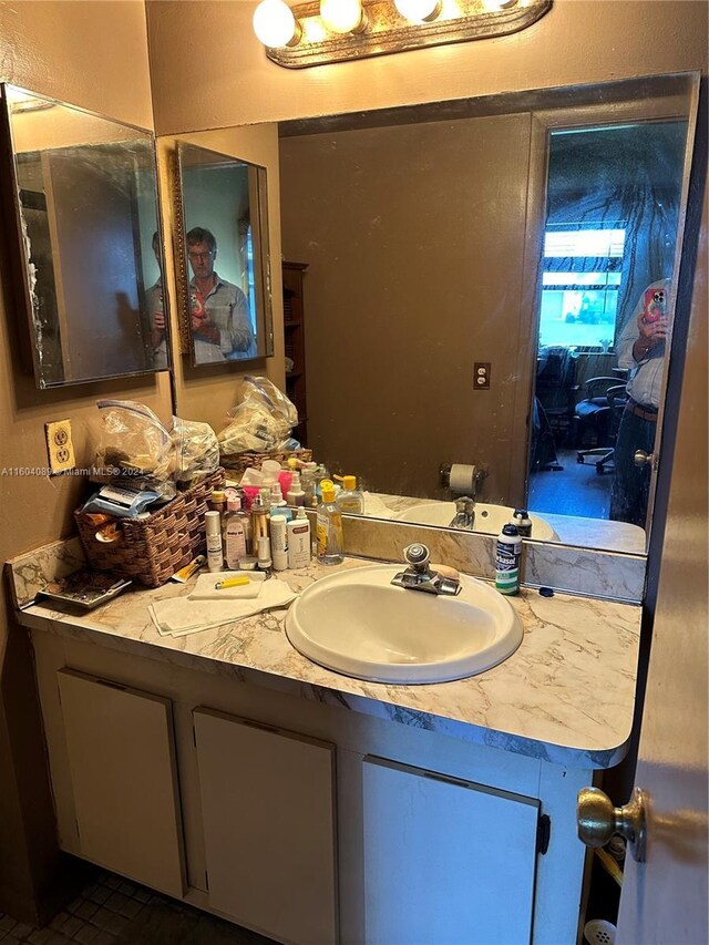 bathroom featuring vanity and tile patterned flooring