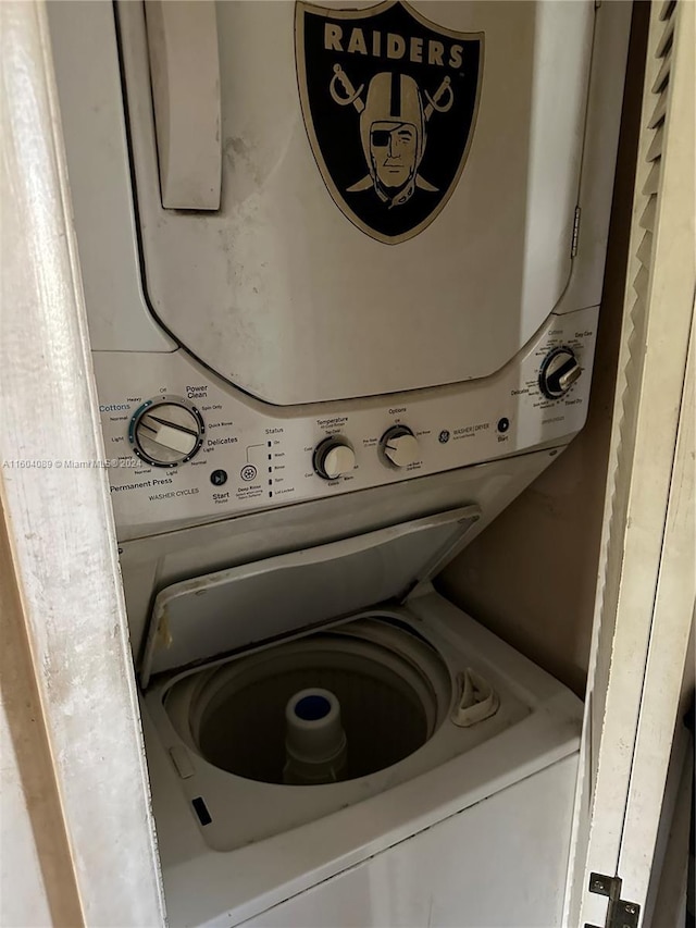 laundry room with stacked washer and dryer and laundry area