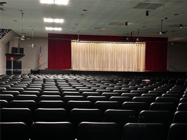 cinema room featuring a ceiling fan