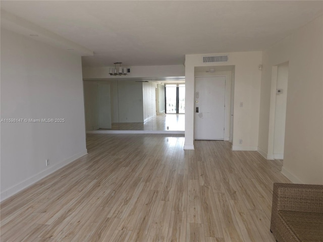 1121 Crandon Blvd Unit D604, Key Biscayne, FL 33149 - spare room featuring baseboards, visible vents, and light wood-type flooring