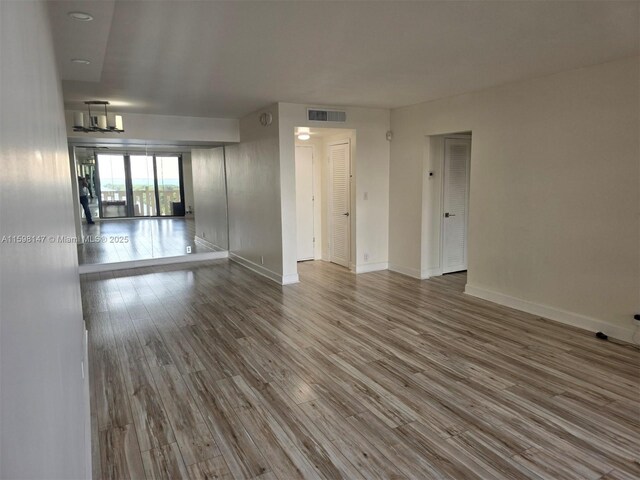 1121 Crandon Blvd Unit D604, Key Biscayne, FL 33149 - spare room featuring baseboards, wood finished floors, and visible vents
