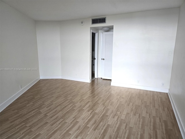 1121 Crandon Blvd Unit D604, Key Biscayne, FL 33149 - unfurnished room with baseboards, wood finished floors, and visible vents