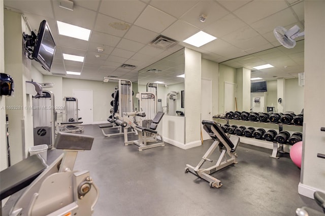 workout area featuring a paneled ceiling