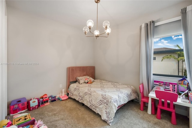 carpeted bedroom featuring a chandelier