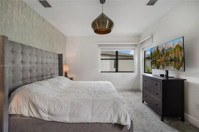 bedroom with light colored carpet