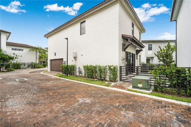 view of property exterior with a garage