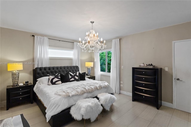 bedroom with a chandelier and light tile patterned floors