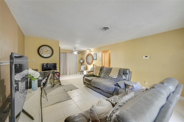 tiled living room with ceiling fan