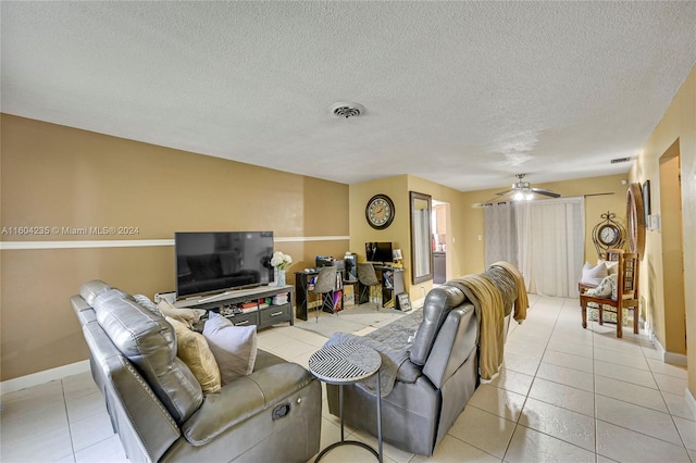 living room featuring ceiling fan and light tile patterned floors