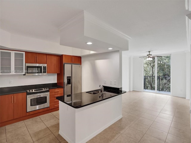 kitchen featuring crown molding, sink, ceiling fan, light tile patterned floors, and stainless steel appliances