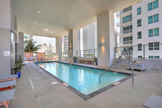 view of swimming pool featuring a patio