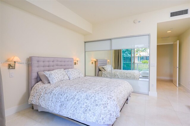 bedroom with light tile flooring