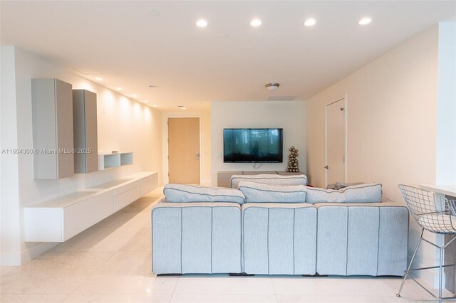 living room featuring light tile floors