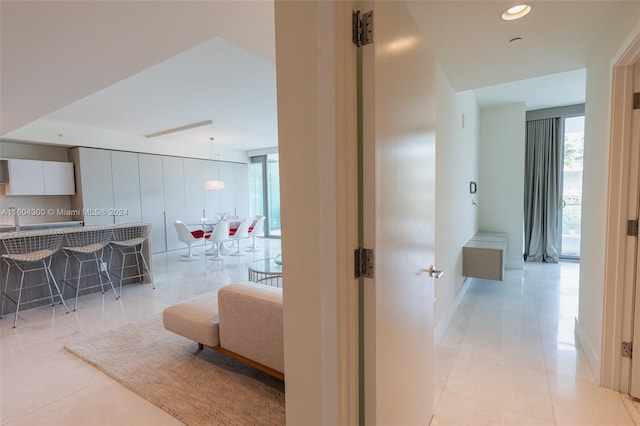 hallway featuring light tile flooring