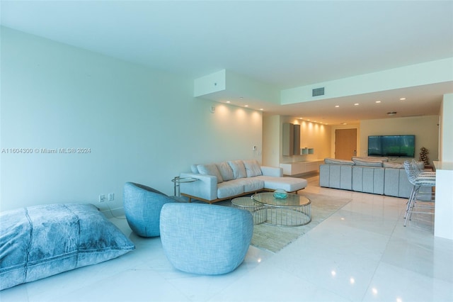 living room featuring tile floors