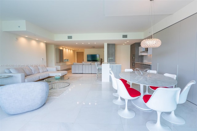 dining area featuring light tile floors